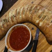 Meat Lovers Stromboli (Large) · Stuffed with meatball, sausage, Canadian ham, pepperoni, bacon, and mozzarella.