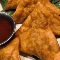 Crispy Pork Wonton · Six pieces. Wontons stuffed with pork, egg, and scallions. Flavors of sesame and soy. Served...