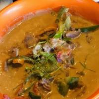 Panang Curry · Lime, galangal root and peppercorn flavored curry with kaffir lime leaf slices and bell pepp...