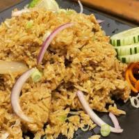 Curry Fried Rice · Curry flavored jasmine rice with egg, onions, scallions and garlic. Served with cucumber sli...