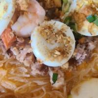 Palabok · Rice noodle with shrimp sauce and pork and shrimp toppings.