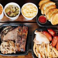 Family Combo · Serves 5-6 people. Includes Ribs, Pulled Pork, Sliced Turkey, Sliced Chicken, Brisket and Sa...