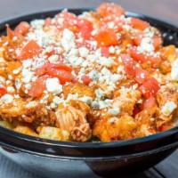 Buffalo Chicken Salad · Fried buffalo chicken, ripe avocado, chopped tomatoes, crumbled blue cheese and croutons.