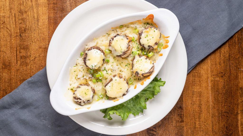 Stuffed Mushrooms · Stuffed with herbed cream cheese served over rice pilaf and topped with jack cheese.
