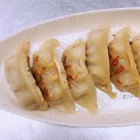 Gyoza · Six pieces of pan fried pork dumplings.