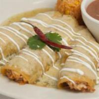 Enchiladas Verdes · Three flavorful shredded chicken enchiladas covered with salsa verde and a blend of Mexican ...