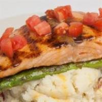 Mango Salmon · Succulent salmon fillet, grilled to order. Served with grilled asparagus, home-made mango-te...