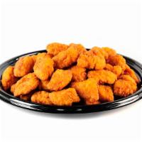 Boneless Wings (20) · Cooked wing of a chicken coated in Buffalo sauce.