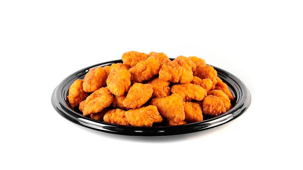 Boneless Wings (15) · Cooked wing of a chicken coated in Buffalo sauce.