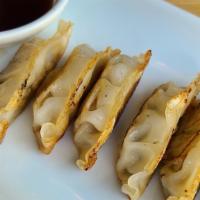 Pan Fried Pork & Chicken Gyoza · 6 pan fried japanese style dumplings, pork and chicken mixture, dipping sauce (comes on the ...