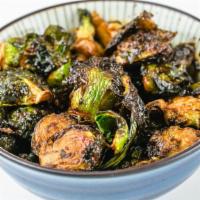 Crispy Brussel Sprouts (V) · spicy korean chili gochujang vinaigrette, toasted bread crumbs. contains NO cheese