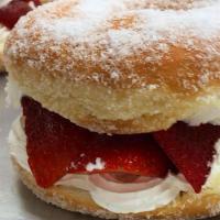 Strawberry Donut · Filled with strawberry jelly and topped with powdered sugar.