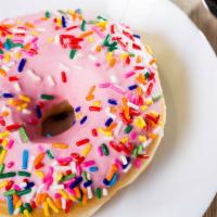 Full Party Donut · Donut covered with pink chocolate and color sprinkles.