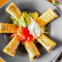 Chicken Taquitos · Crisp corn tortilla filled with our fresh tasty shredded chicken, garnished with tomatoes, g...