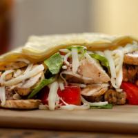 Mixto Crepe · Marinated chicken breast and steak, melted mozzarella cheese, chopped tomatoes, crispy romai...