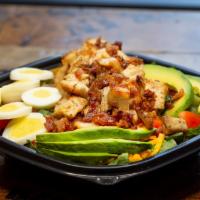 Cobb Salad · Crispy romaine lettuce, grilled chicken breast, egg, bacon, cheddar cheese, chopped tomatoes...