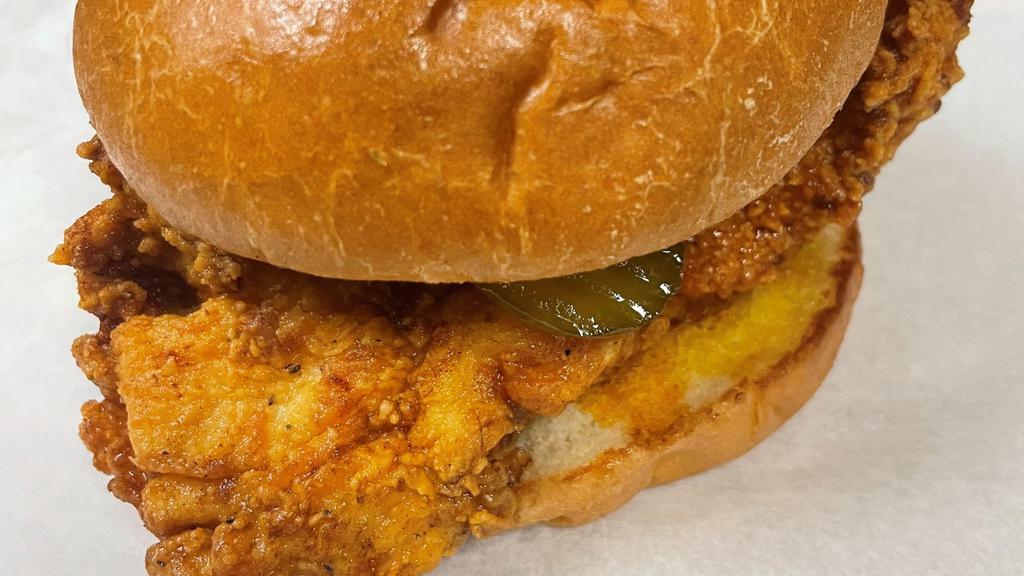 Chicken Sandwich · Crispy fried chicken breast and homemade pickle between brioche buns