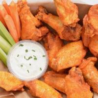 12 Classic Bone-In Wings · 12 Classic bone-in chicken wings tossed with wing sauce and served with fresh carrot & celer...