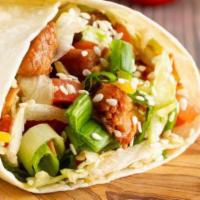 Asian Wrapito® · Our tangy teriyaki chicken thighs, lettuce, tomatoes, scallions, sesame seeds and yellow ric...