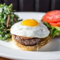Wedge Burger · sunny-side up egg, lettuce, tomato, danish blue, candied bacon & garlic dressing