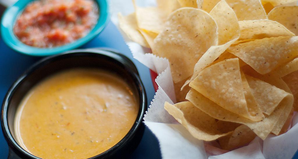 Queso · Blend of melted cheese, Green Chile sauce and Ranchero sauce.