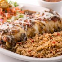 Steak Burrito · A flour tortilla stuffed with grilled steak and jack cheese, topped with Hatch Green Chile (...