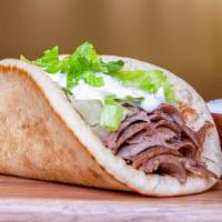 Gyro Wrap · Lamb gyro meat, lettuce, z sauce, wrapped in pita bread.