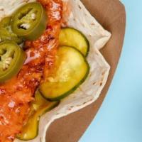 Nashville Hot Chicken · Tossed In Our Homemade Nashville Hot Sauce And Topped With Cilantro Lime Slaw + House Pickle...