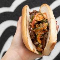 Yumbii Philly · Protein Of Your Choice Topped With Sriracha Queso + Red Onion + Green Onion + Homemade Cucum...