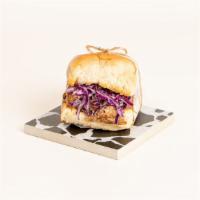 Bbq Brisket Slider · Delicious brisket with bbq sauce, coleslaw, and pickles on a toasted bun.