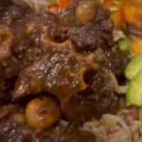 Oxtail · Calling on the east Indian side of Jamaican heritage. Goat meat seasoned with scallion, garl...