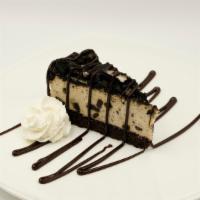 Oreo Mousse Cake (Slice) · White chocolate, oreo mouse on a oreo cookie crust.  (Served by the Slice)