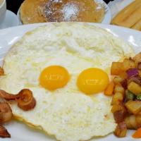 Desayuno Combo · Combo breakfast. Fried or scrambled eggs with a choice of ham, bacon or sausage with pancake...