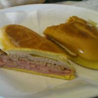 Media Noche · Midnight bread, bolo ham, pork, pickles and Swiss cheese.