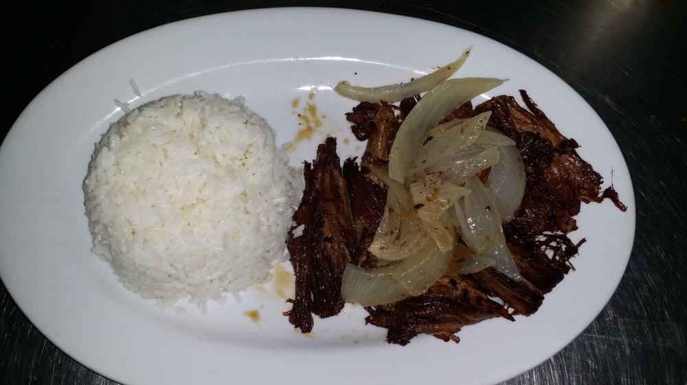 Vaca Frita · Grilled shredded beef with onions.