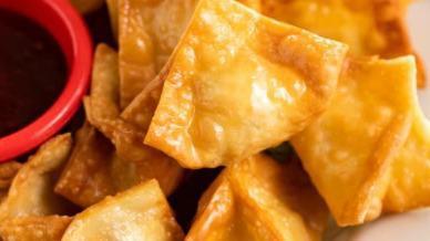 Crab Rangoon · Cream cheese, crab meat and scallions wrapped in wonton skin, fried to golden perfection.