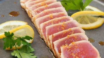 Tuna Tataki · Thin slices of seared tuna served with ponzu sauce.