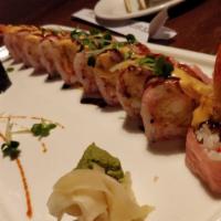 Sakura Roll · Fish tempura, shrimp tempura, kanikama and masago mixed with tempura flake and avocado, wrap...