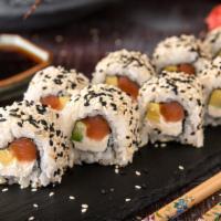 Spicy Tuna Roll · House favorite spicy tuna roll made with tuna, scallions & spicy mayo wrapped into sushi rice.