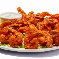 24 Buffalo Shrimp · Hand-breaded shrimp with your choice of sauce on the side.  Tender inside, crispy outside. 8...