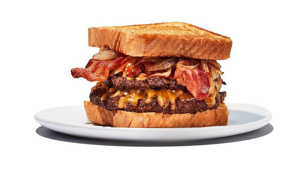 Twisted Texas Melt · Two 1/4lb. burgers with Daytona beach sauce, caramelized onions, bacon and cheddar cheese served on Texas toast. 1020 cal