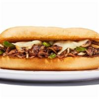 Philly Cheesesteak Sandwich · Shaved steak sauteed with onions, peppers and mushrooms topped with provolone cheese served ...