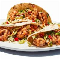 Baja Shrimp Tacos · Baja Shrimp Tacos - We grill seasoned shrimp, then wrap them in flour tortillas with an un-s...