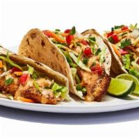 Fish Tacos Grilled · Grilled cod served on soft tortillas with diced tomato, cabbage and house spicy sauce. . 700...