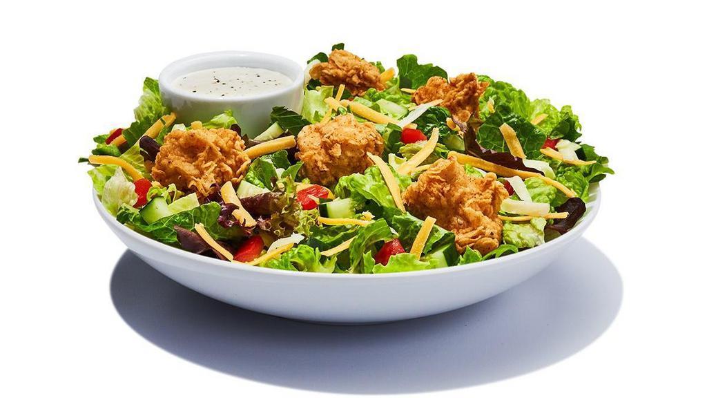 Chicken Garden Salad · Mixed lettuce piled with tomatoes, crisp cucumbers, cheddar cheese, croutons and your choice of salad dressing.  Choose grilled or fried chicken.