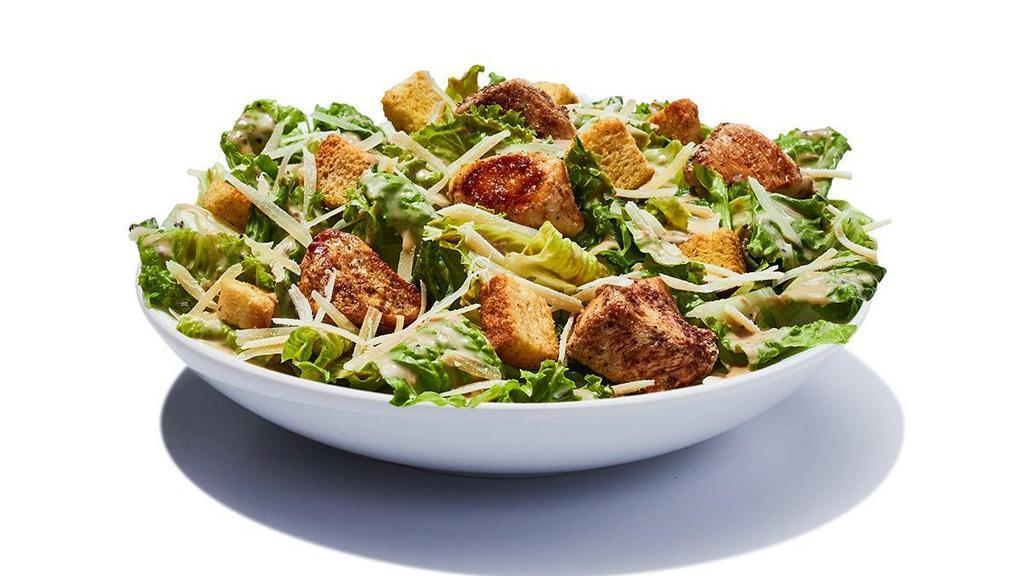 Chicken Caesar Salad · Romaine lettuce with shredded parmesan cheese, home style croutons and creamy Caesar dressing, topped with slices of grilled chicken. Grilled 410 cal | Fried 770 cal