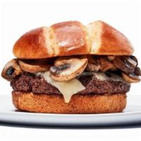 Mushroom Swiss Burger · The name says it all - One 1/4 lb patty topped with  sauteed mushrooms and melted Swiss chee...