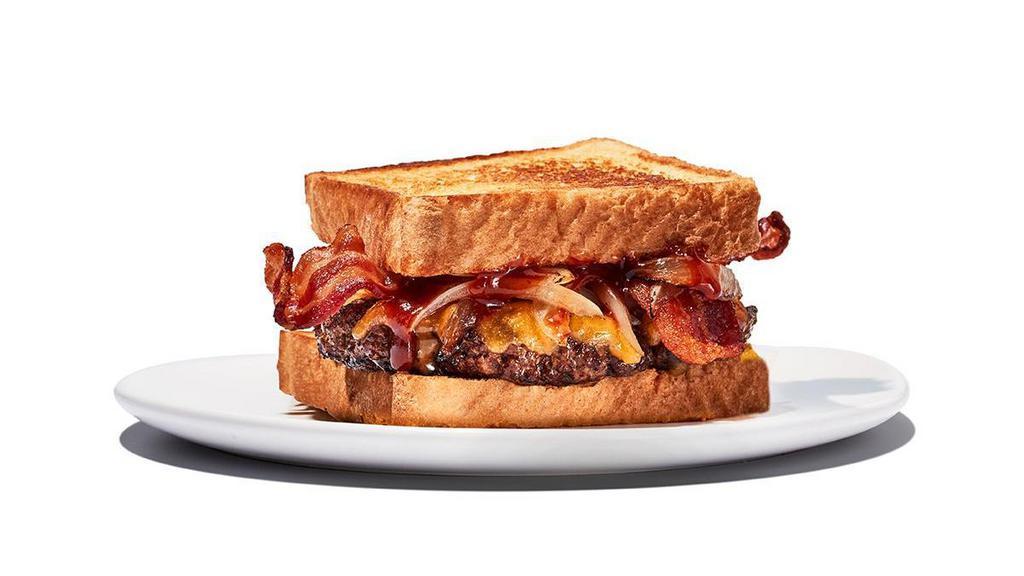 Twisted Texas Melt · Yippee Kai Yay, hungry trucker. One 1/4 pound patty meets caramelized onions, bacon and cheddar cheese, fully loaded with a layer of our Daytona Beach sauce and served on Texas Toast. Includes choice of fries.