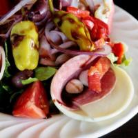 Antipasto Salad · Bed of romaine lettuce, cherry tomatoes, roasted bell pepper, artichoke heart, pepperoncini,...