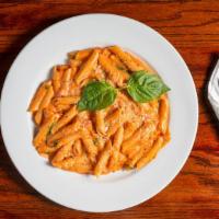 Penne Alla Vodka · Sautéed with pancetta and garlic. Served in a creamy tomato and vodka sauce.